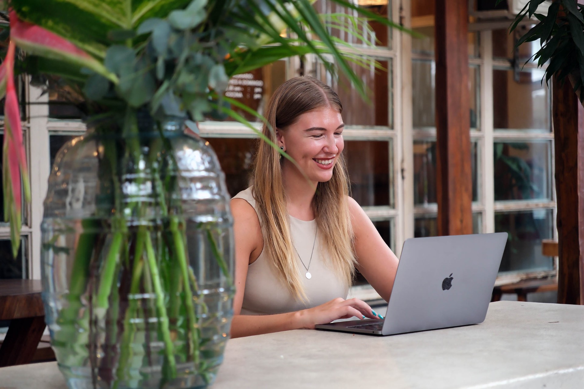 Georgie, founder of The Freedom Route, working on her laptop